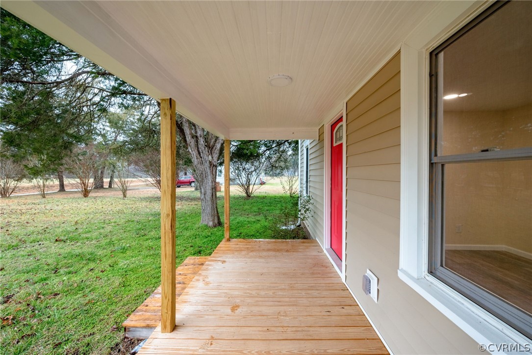 916 Nutbush Road Victoria, VA 23974 - Photo 7 of 25 a front view of a house with a yard and an outdoor seating