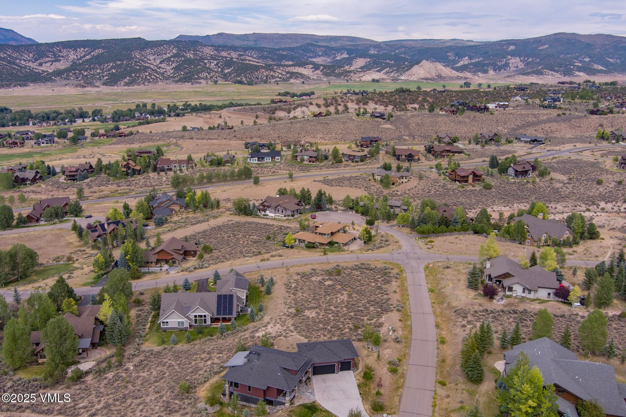 259 Harrier Circle Eagle, CO 81631 - Photo 18 of 28 an aerial view of a city with lots of residential buildings and mountain view in back