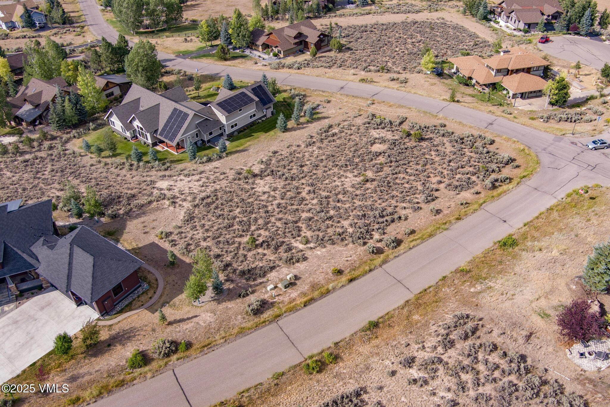 259 Harrier Circle Eagle, CO 81631 - Photo 9 of 28 a view of a backyard with wooden fence