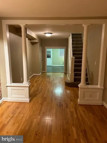 a view of entryway with wooden floor
