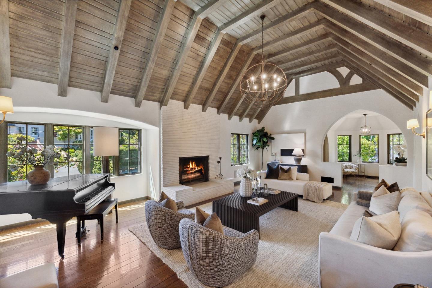 540 Chelmsford Road Hillsborough, CA 94010 - Photo 11 of 49 a living room with furniture fireplace and a large window