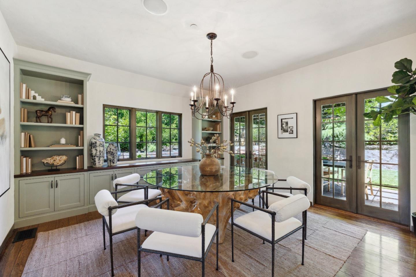 540 Chelmsford Road Hillsborough, CA 94010 - Photo 13 of 49 a dining room with furniture large windows and a chandelier