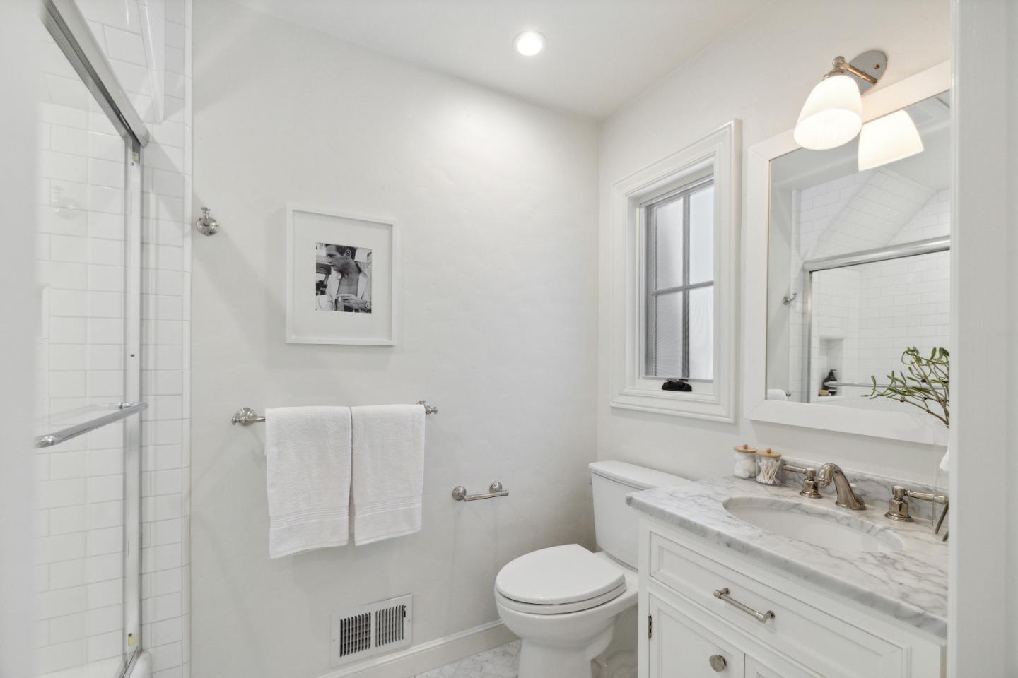 540 Chelmsford Road Hillsborough, CA 94010 - Photo 21 of 49 a bathroom with a granite countertop toilet sink and mirror
