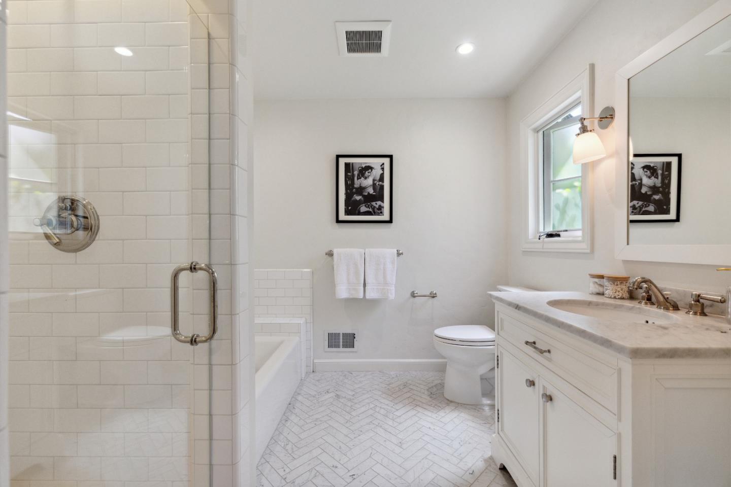 540 Chelmsford Road Hillsborough, CA 94010 - Photo 23 of 49 a bathroom with a granite countertop sink a toilet and a mirror