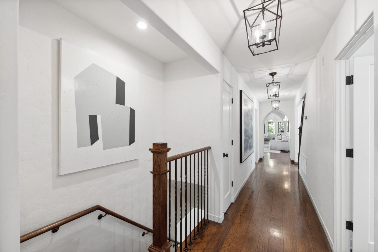 540 Chelmsford Road Hillsborough, CA 94010 - Photo 24 of 49 a view of a hallway with wooden floor and staircase