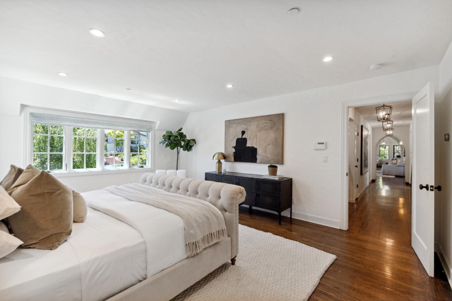 540 Chelmsford Road Hillsborough, CA 94010 - Photo 25 of 49 a bedroom with a bed and a large window