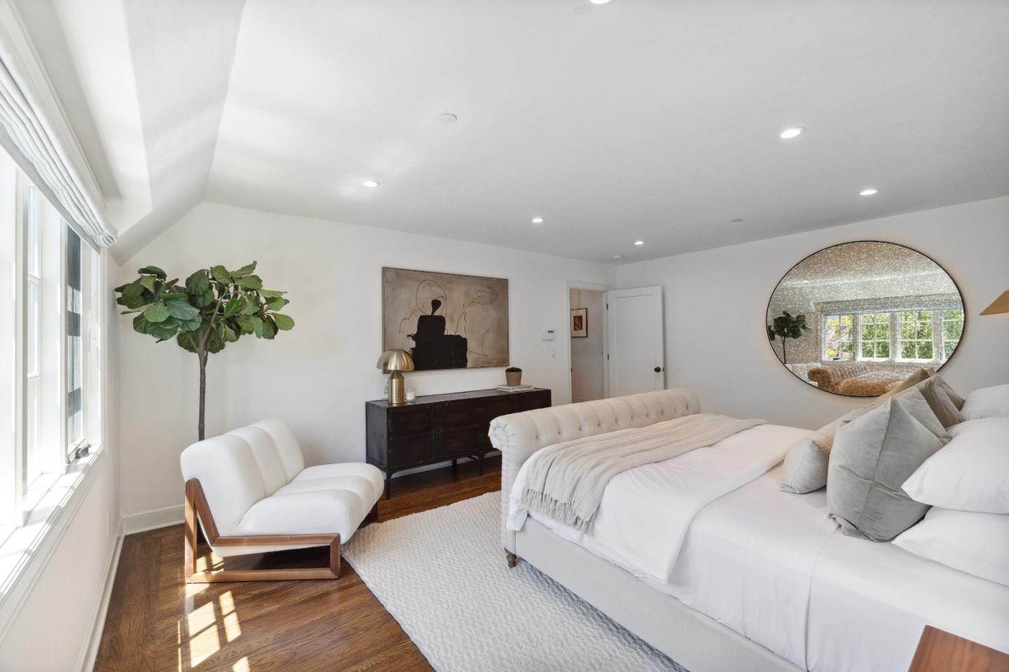 540 Chelmsford Road Hillsborough, CA 94010 - Photo 26 of 49 a bedroom with a bed and a chandelier