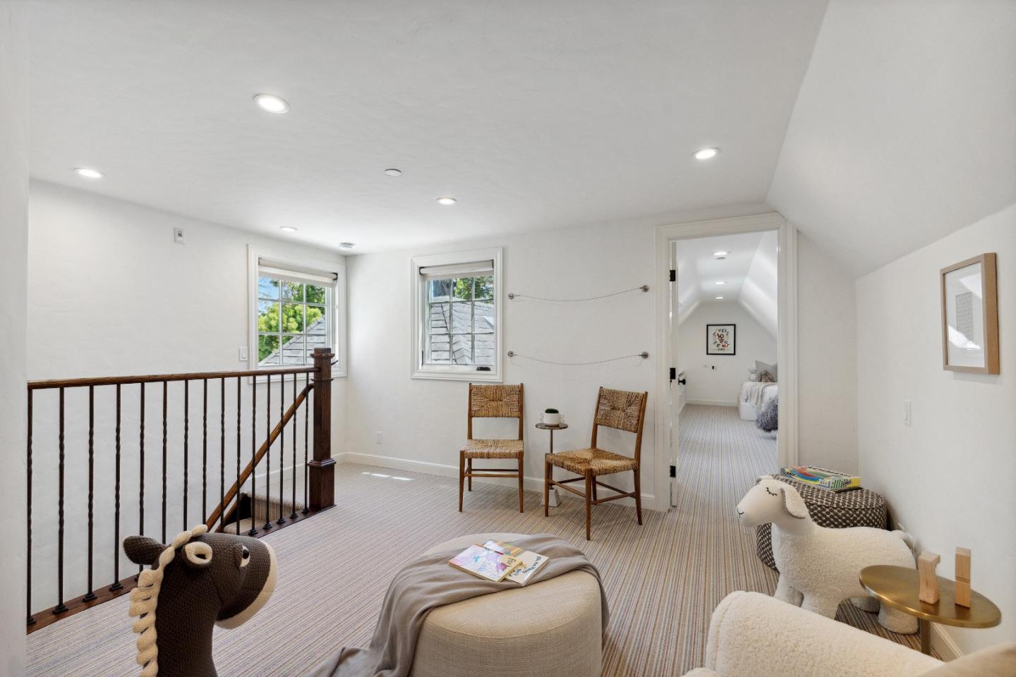 540 Chelmsford Road Hillsborough, CA 94010 - Photo 30 of 49 a living room with furniture stairs and a window