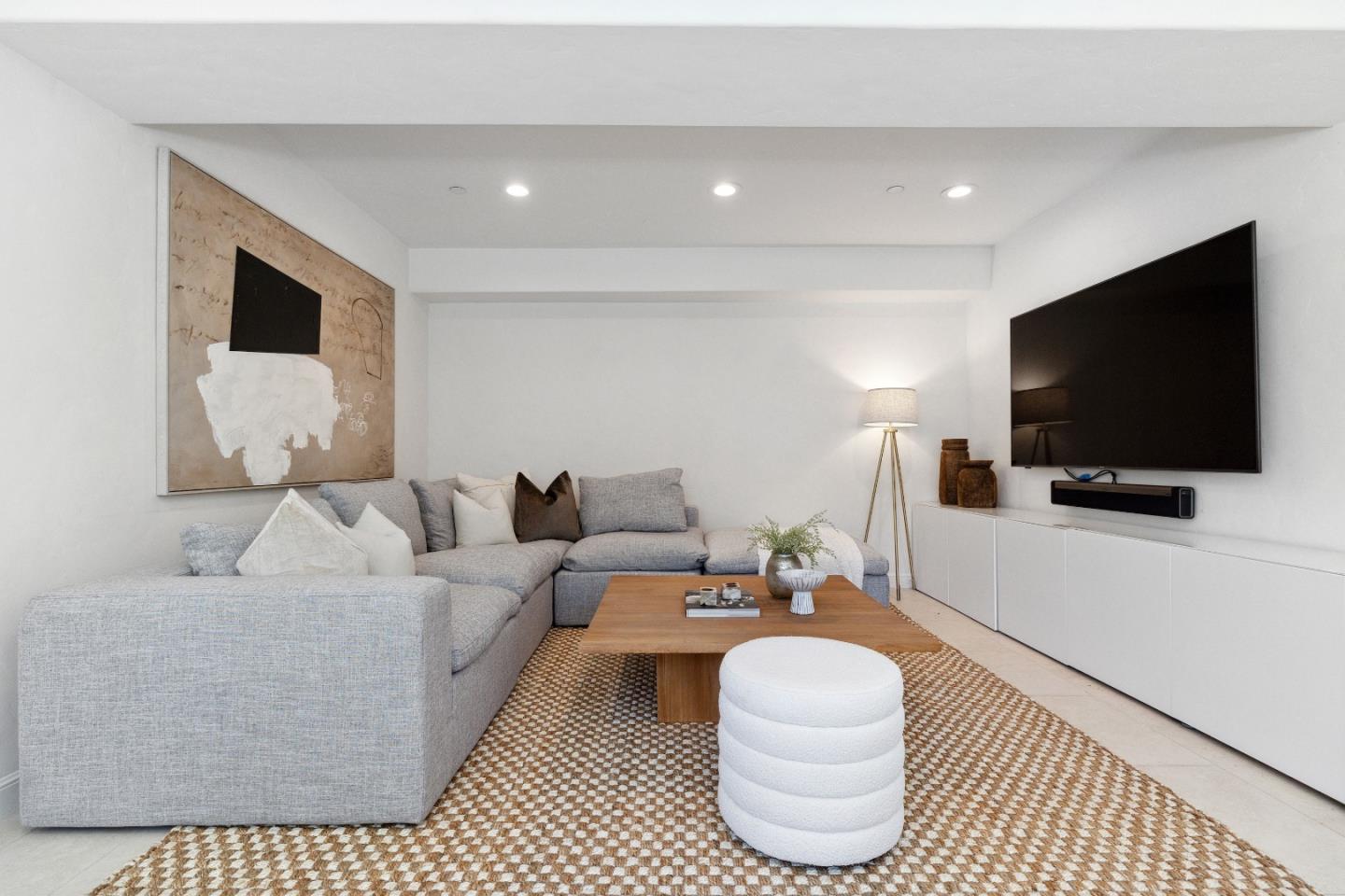 540 Chelmsford Road Hillsborough, CA 94010 - Photo 34 of 49 a living room with furniture and a flat screen tv