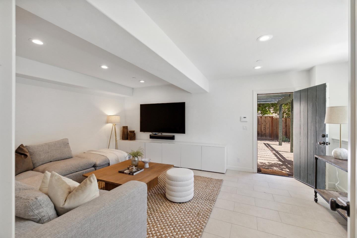 540 Chelmsford Road Hillsborough, CA 94010 - Photo 35 of 49 a living room with furniture and a flat screen tv