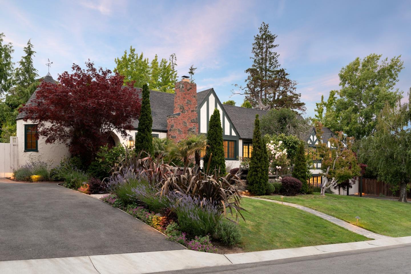 540 Chelmsford Road Hillsborough, CA 94010 - Photo 37 of 49 a front view of a house with a garden