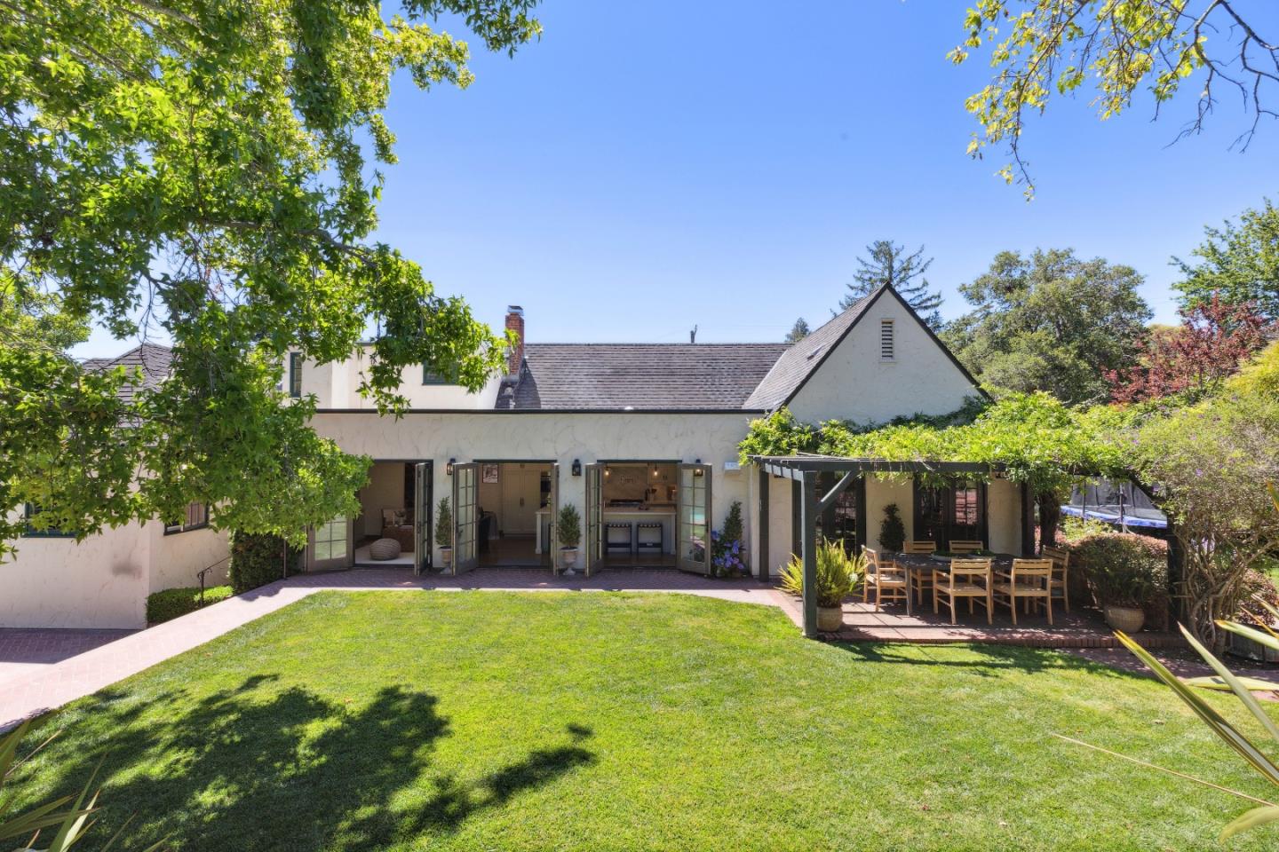 540 Chelmsford Road Hillsborough, CA 94010 - Photo 41 of 49 a view of a house with backyard porch and sitting area