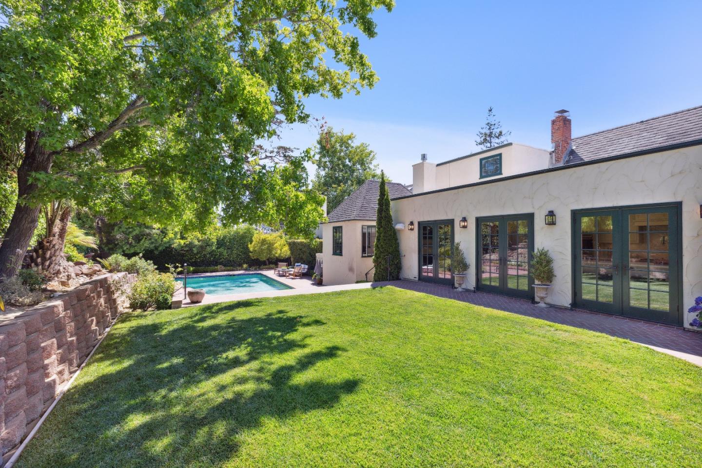 540 Chelmsford Road Hillsborough, CA 94010 - Photo 48 of 49 a view of a house with a yard and sitting area