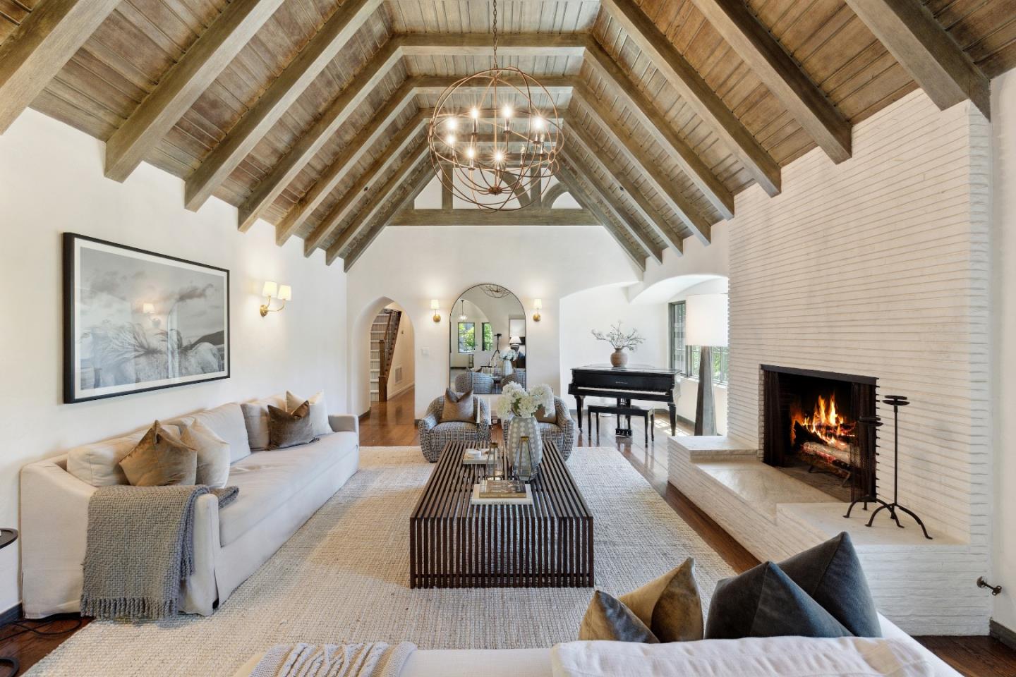 540 Chelmsford Road Hillsborough, CA 94010 - Photo 10 of 49 a living room with furniture and a fireplace