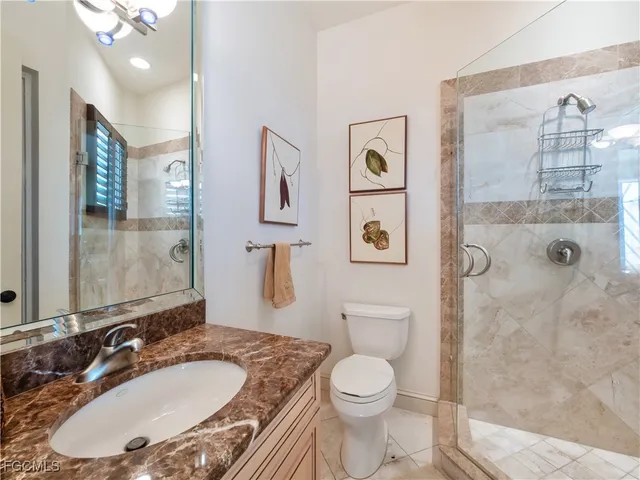 a spacious bedroom with a bed and furniture