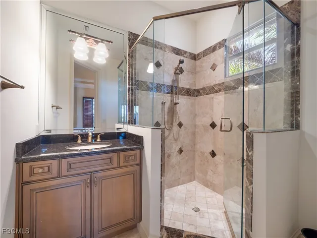 a living room with furniture ceiling fan and a rug