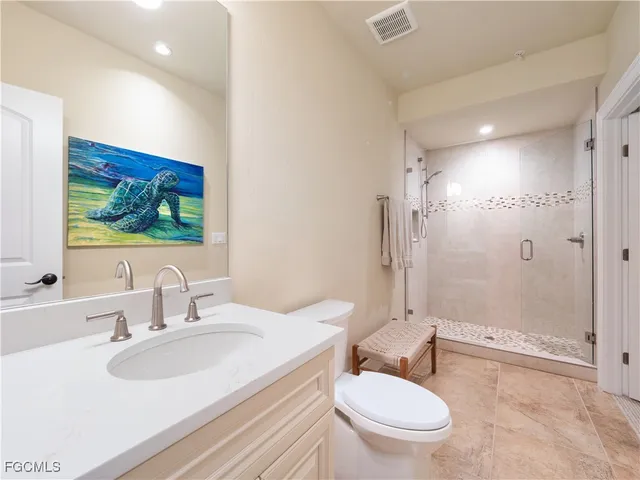 a view of a livingroom with furniture and a flat screen tv