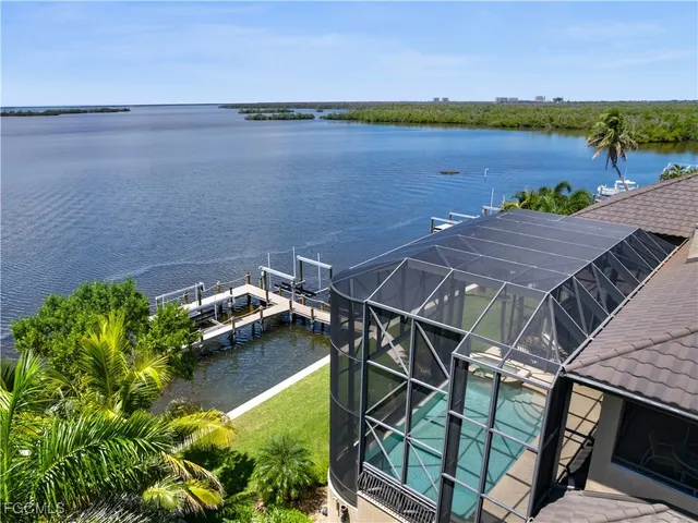 a living room with furniture a table and chairs