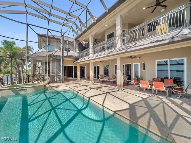 a view of a backyard with a tub and outdoor seating