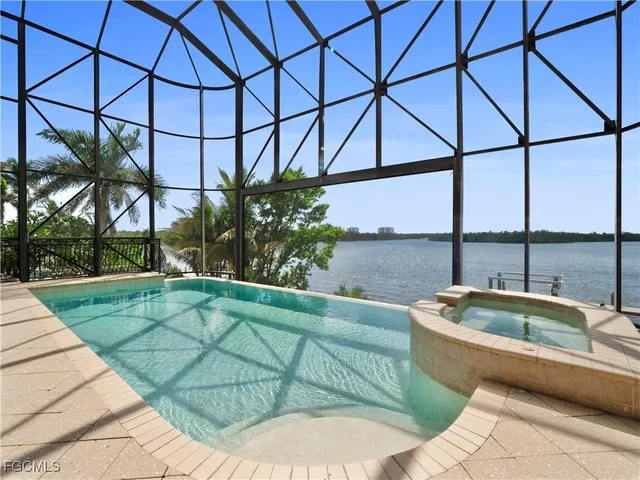 a roof deck with a table and a chairs