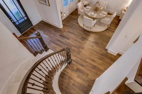 a view of an entryway with wooden floor