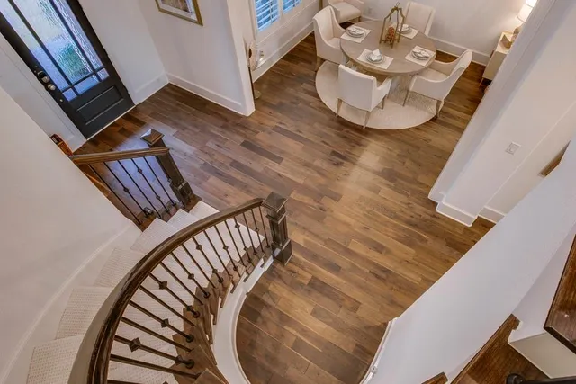 a view of an entryway with wooden floor