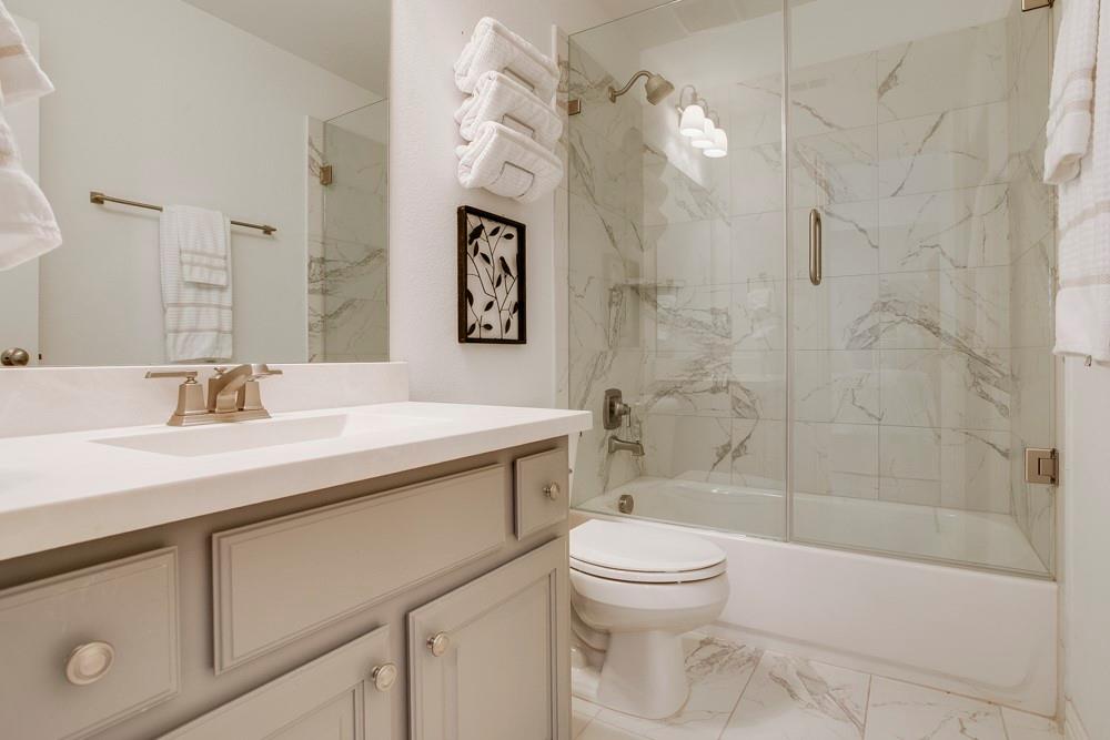 4059 Marble Hill Road Frisco, TX 75034 - Photo 28 of 40 a bathroom with a sink a toilet and shower