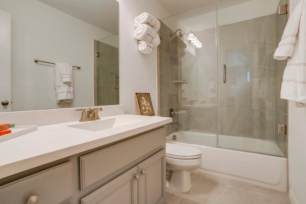 4059 Marble Hill Road Frisco, TX 75034 - Photo 30 of 40 a bathroom with a sink a toilet and shower