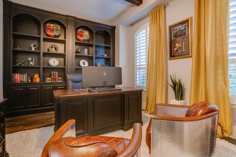 a living room with stainless steel appliances furniture and decor