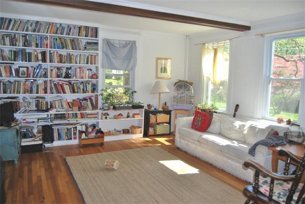 25 Valley Road Lexington, MA 02421 - Photo 3 of 13 a living room with furniture and a book shelf