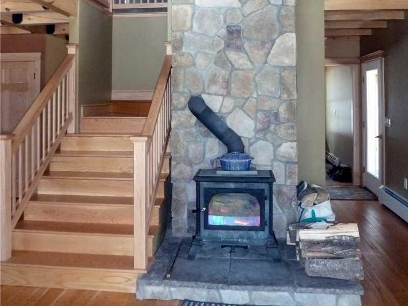 311 East Pond Road Smithfield, ME 04978 - Photo 10 of 26 Living Room. beautiful stonework -...