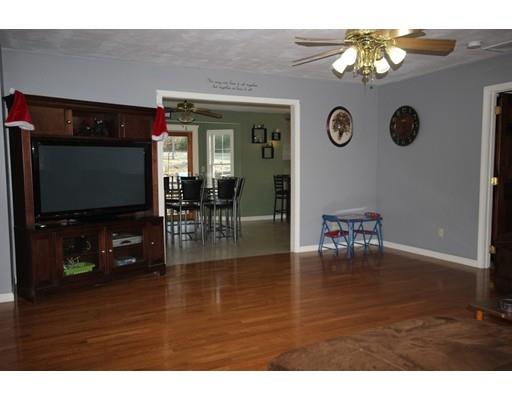 212 Brookfield Road Fiskdale, MA 01518 - Photo 11 of 19 a living room with dining room and wooden floor