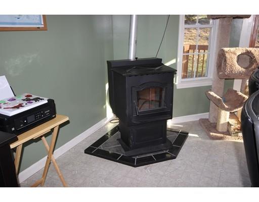 212 Brookfield Road Fiskdale, MA 01518 - Photo 17 of 19 a living room with furniture and a fireplace