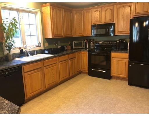 212 Brookfield Road Fiskdale, MA 01518 - Photo 8 of 19 a kitchen with stainless steel appliances granite countertop a stove a sink dishwasher and a refrigerator