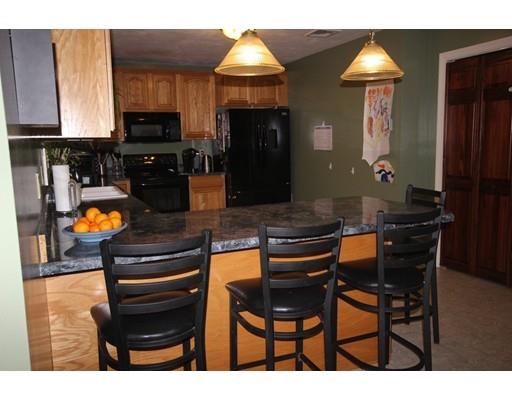 212 Brookfield Road Fiskdale, MA 01518 - Photo 9 of 19 a kitchen with a table and chairs in it
