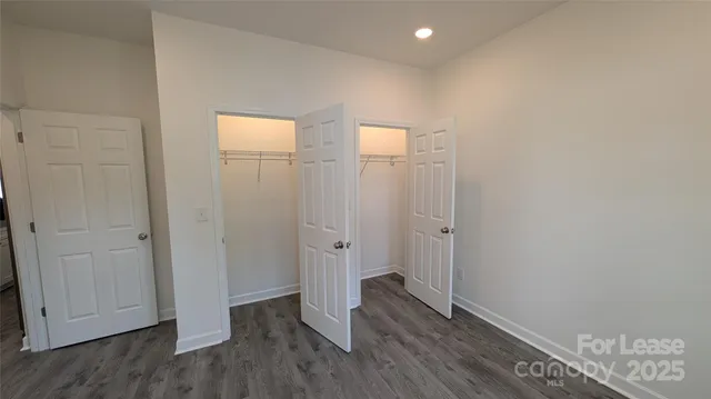 a bathroom with a granite countertop toilet a sink and a bathtub