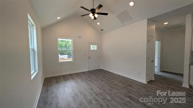 a kitchen with stainless steel appliances a refrigerator and a stove top oven
