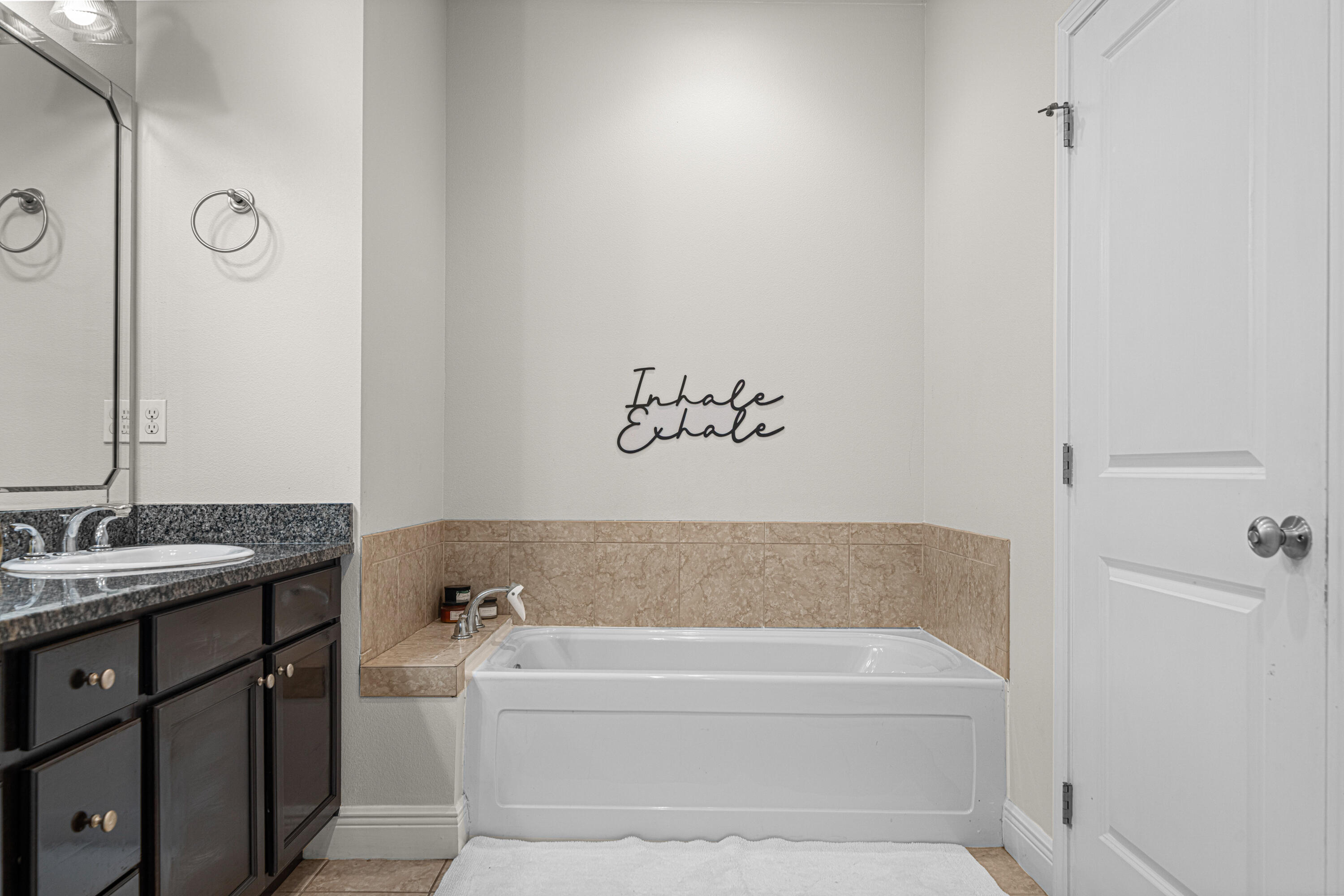3263 Chapelwood Drive Crestview, FL 32539 - Photo 22 of 39 a bathroom with a bathtub and a sink