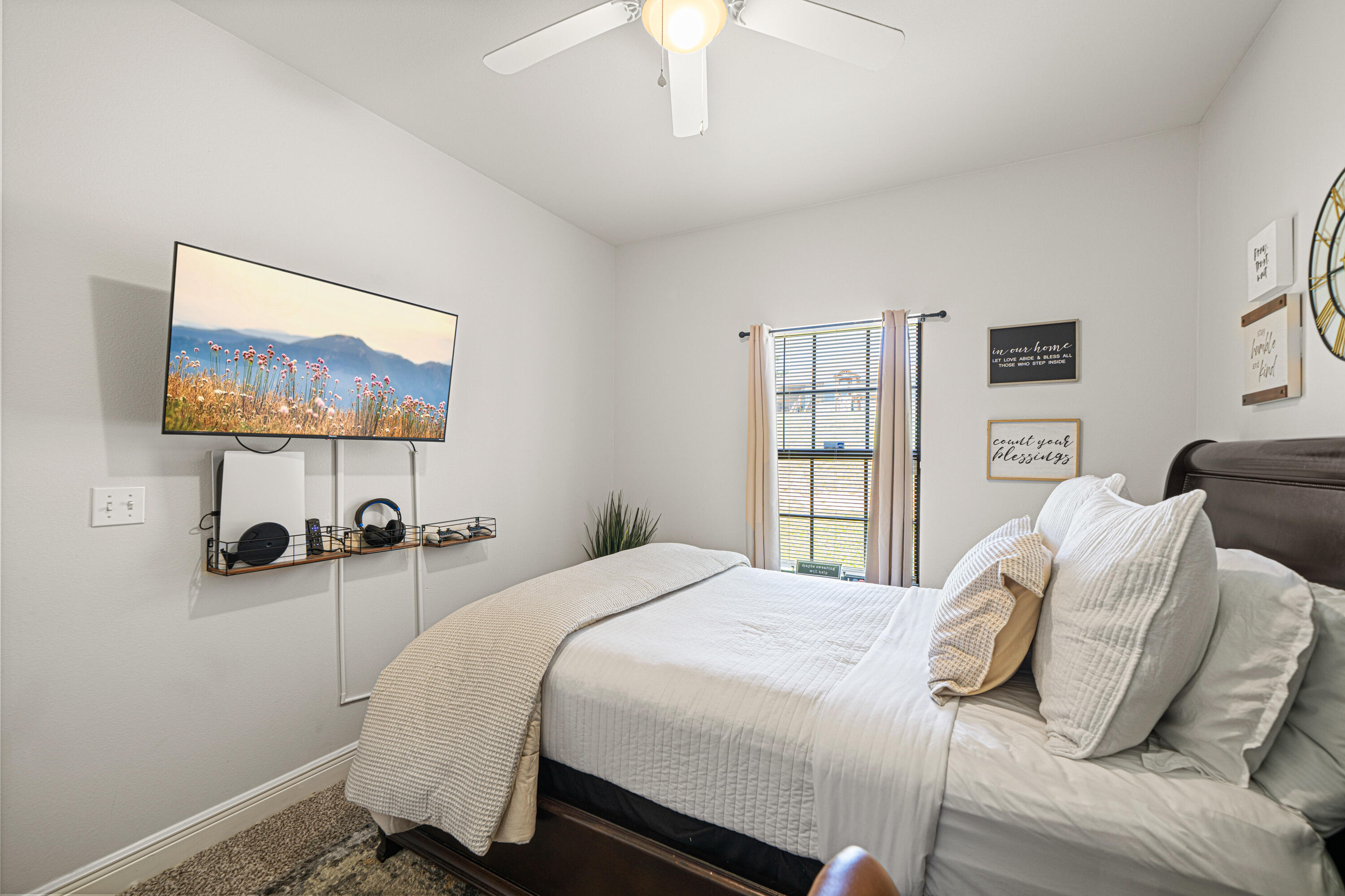 3263 Chapelwood Drive Crestview, FL 32539 - Photo 30 of 39 a bedroom with a bed a wall painting and a window