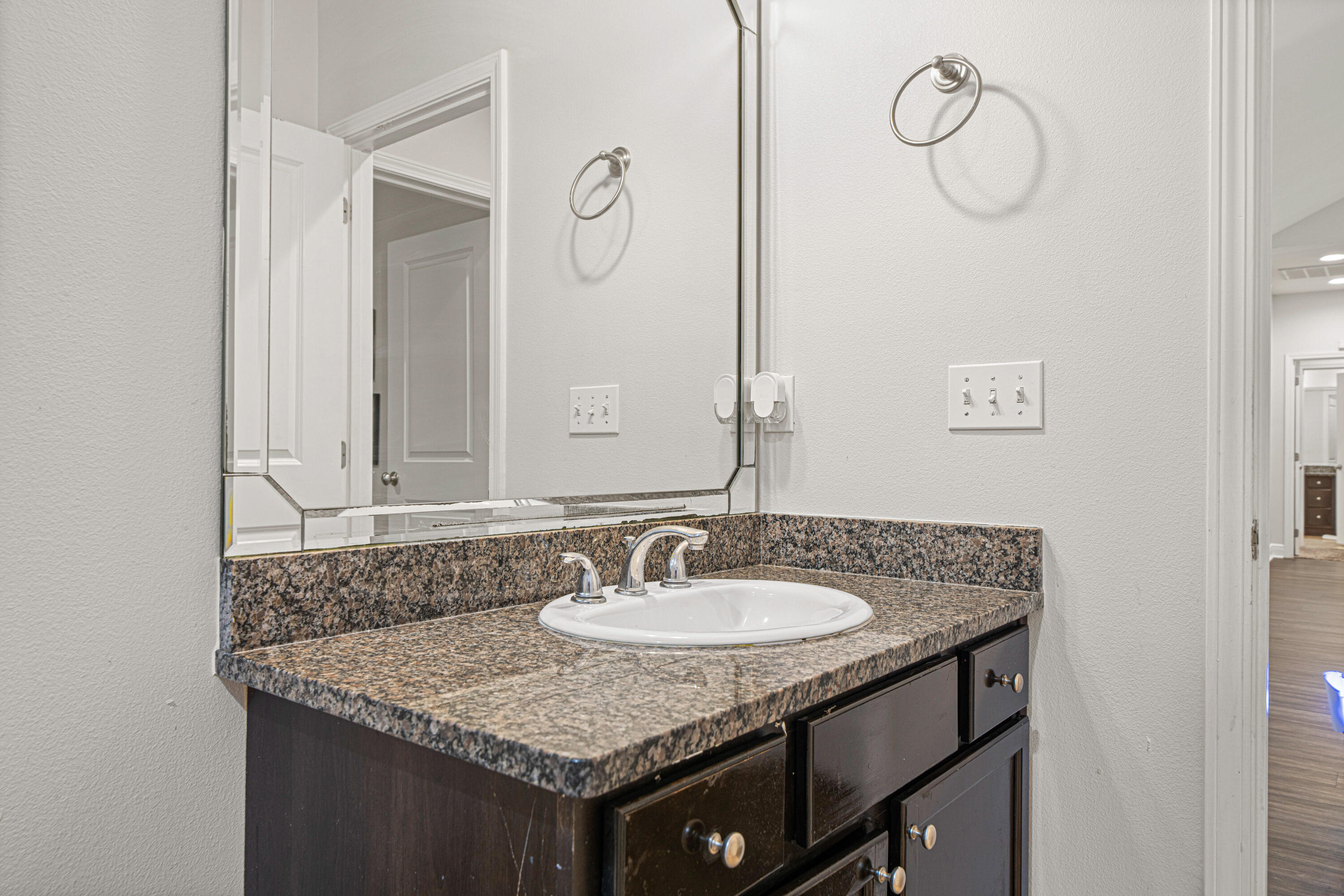 3263 Chapelwood Drive Crestview, FL 32539 - Photo 35 of 39 a bathroom with a granite countertop sink and a mirror