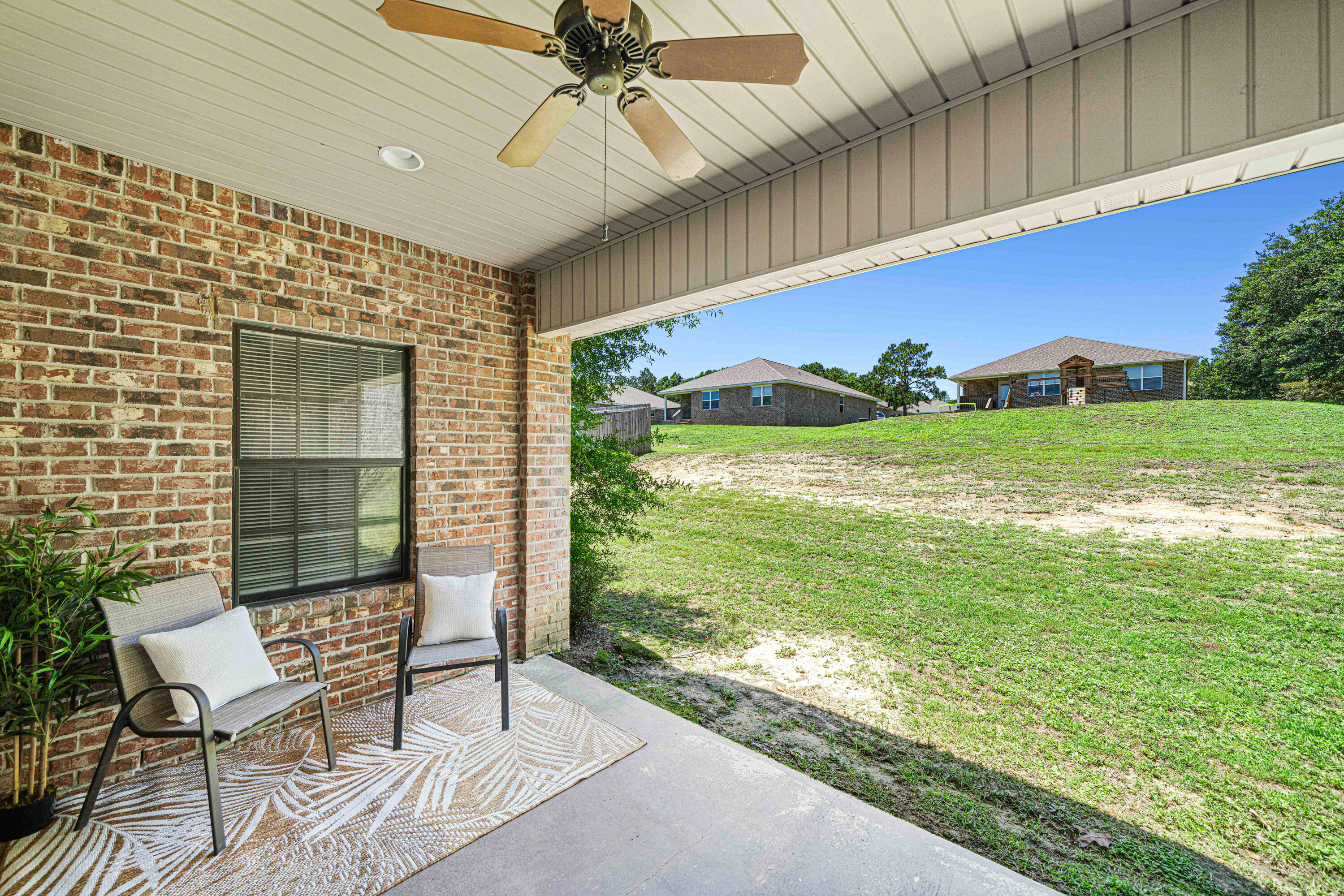 3263 Chapelwood Drive Crestview, FL 32539 - Photo 38 of 39 a view of a chairs and table in patio