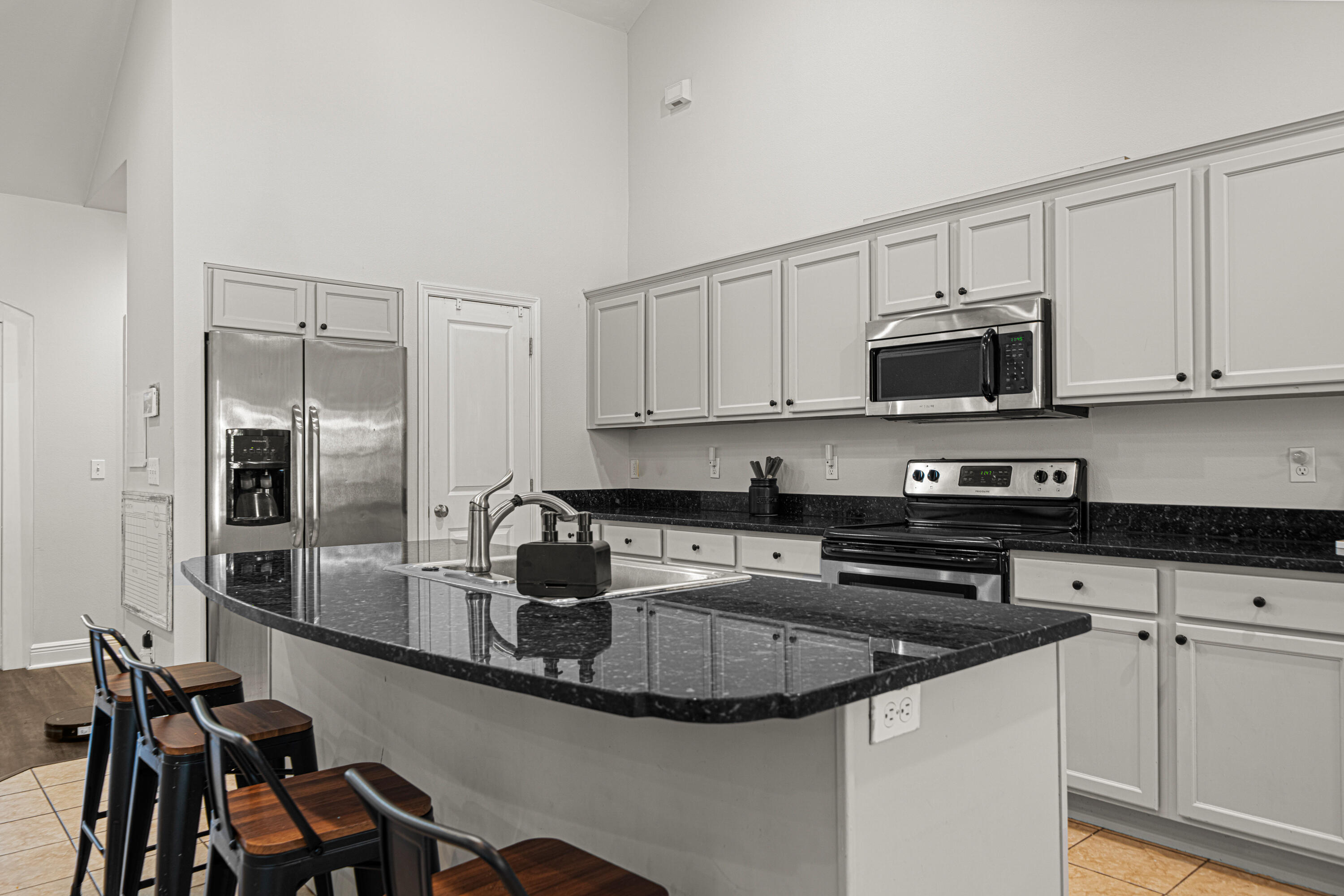 3263 Chapelwood Drive Crestview, FL 32539 - Photo 5 of 39 a kitchen with kitchen island granite countertop a sink and appliances