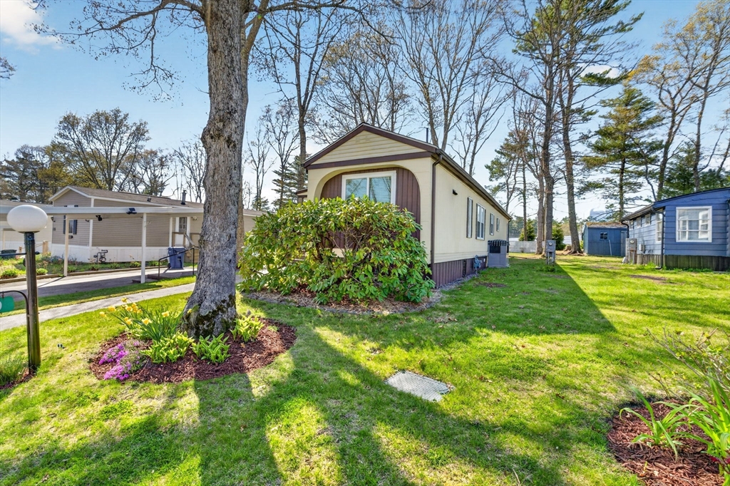 19 Timber Lane Wareham, MA 02571 - Photo 29 of 38 a front view of a house with garden