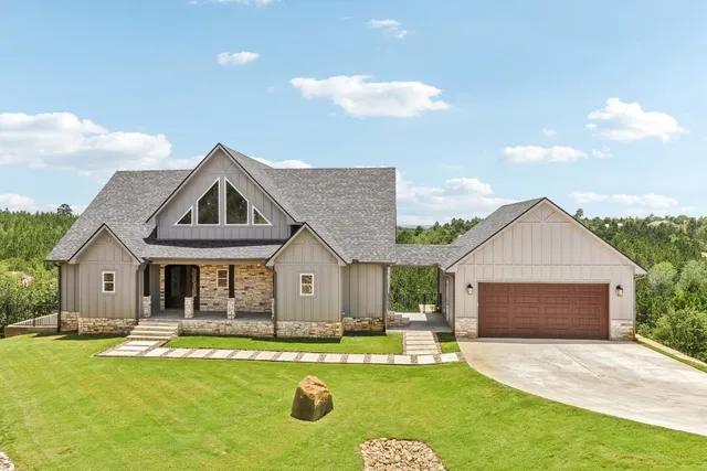 a front view of house with yard outdoor seating and barbeque oven