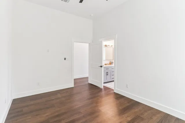 an empty room with wooden floor
