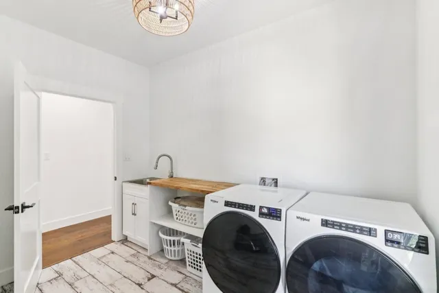 a view of storage and utility room with washer and dryer