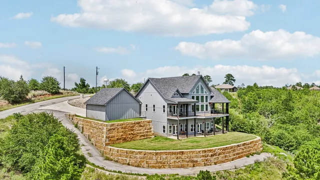 a view of a house with a garden and pathway