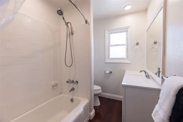 a bathroom with a sink a toilet and a bathtub