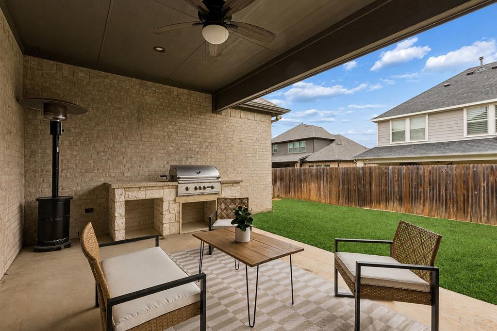 104 Ryder Court Hurst, TX 76053 - Photo 32 of 35 Outdoor Living Featuring Built-In Grill And Fireplace
