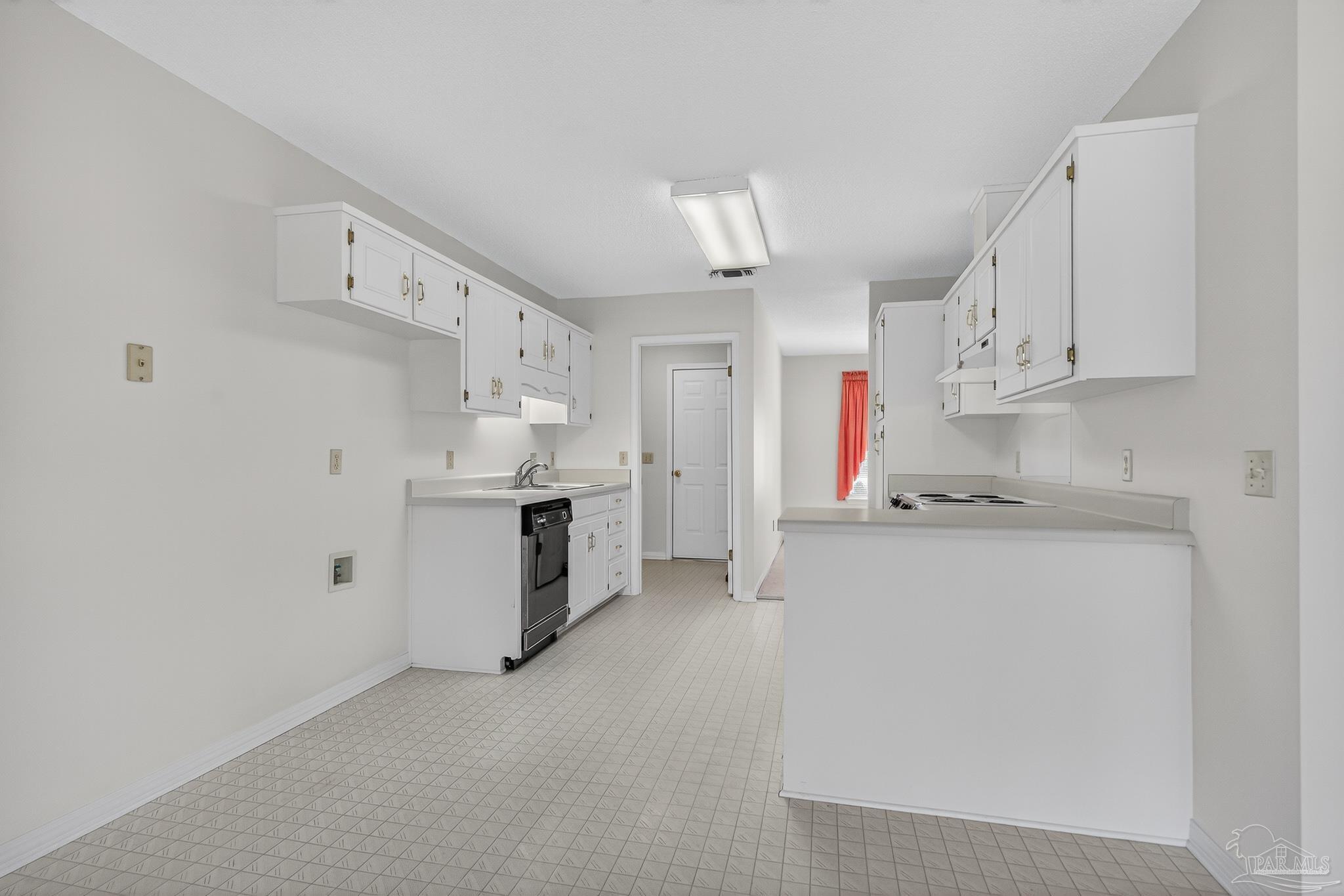 2236 Cricket Ridge Drive Cantonment, FL 32533 - Photo 21 of 57 a kitchen with white cabinets and white appliances